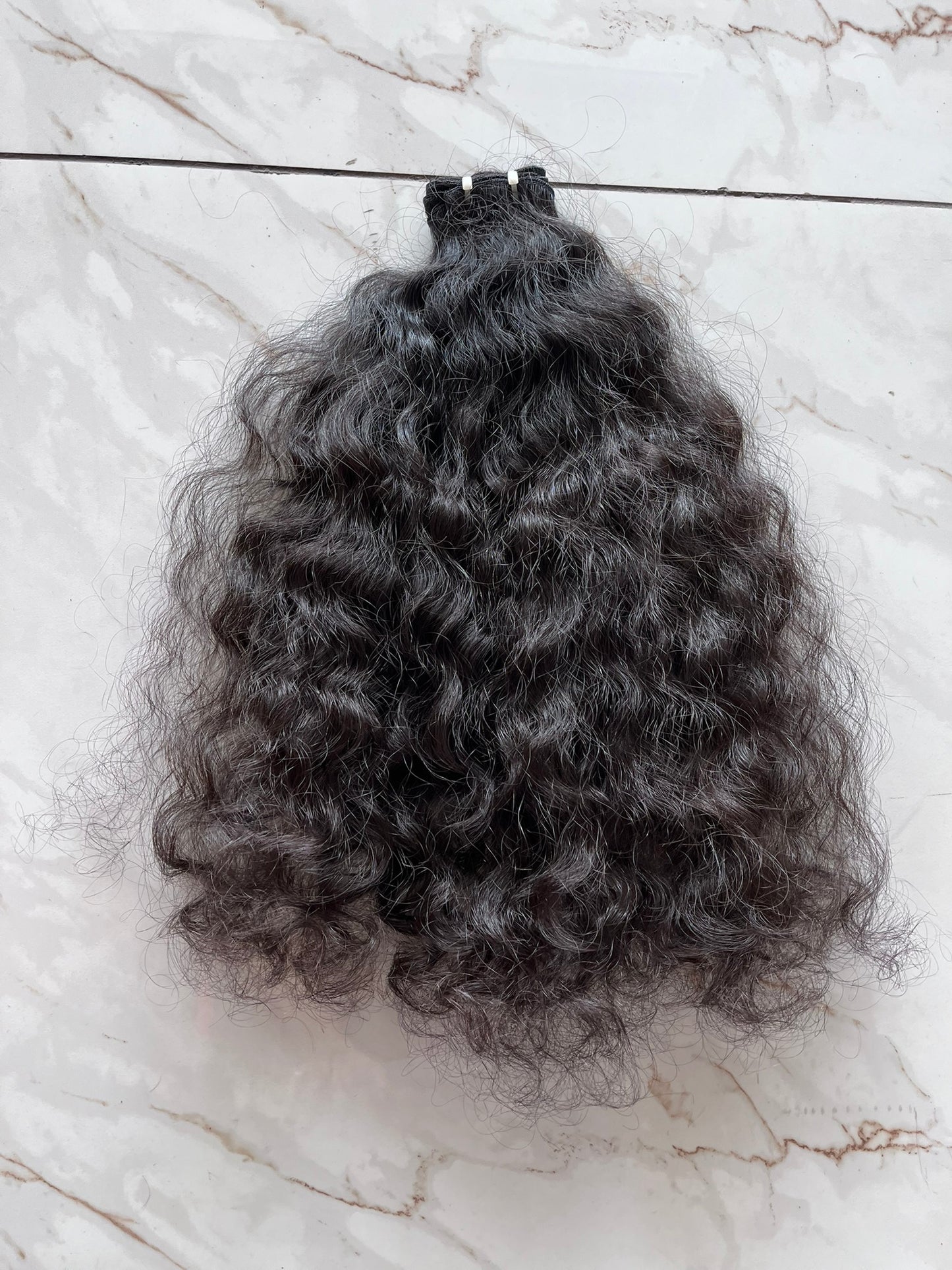 Trames - Cheveux indiens bouclés bruts 