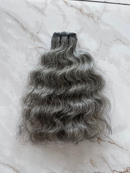 Extensions à clipser indiennes bouclées brutes 