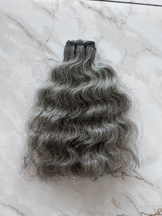 Extensions à clipser indiennes bouclées brutes 
