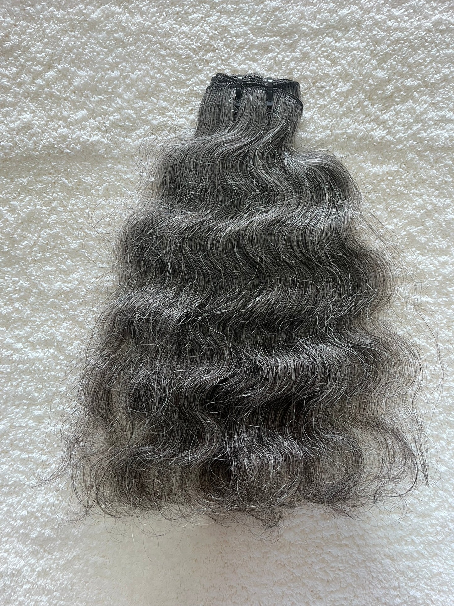 Extensions à clipser indiennes bouclées brutes 