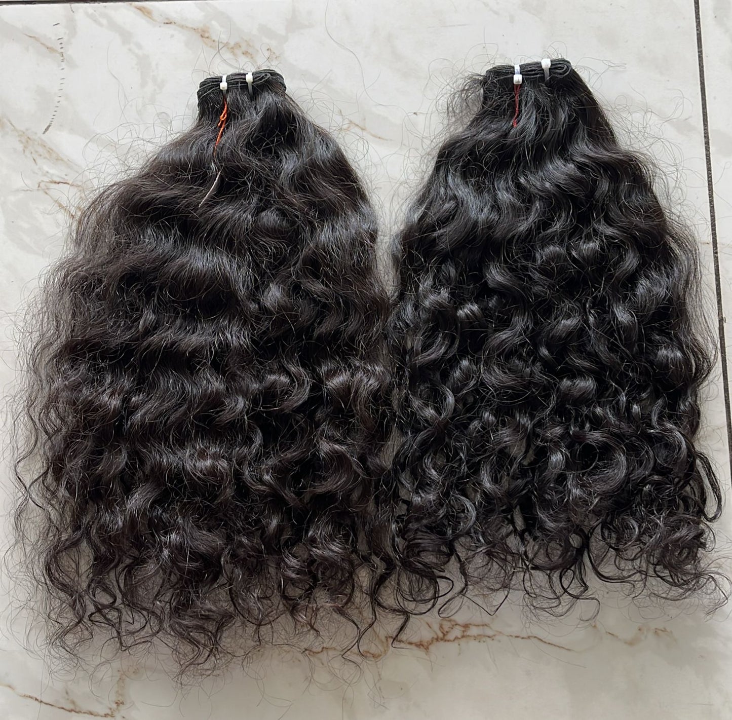 Trames - Cheveux indiens bouclés bruts 